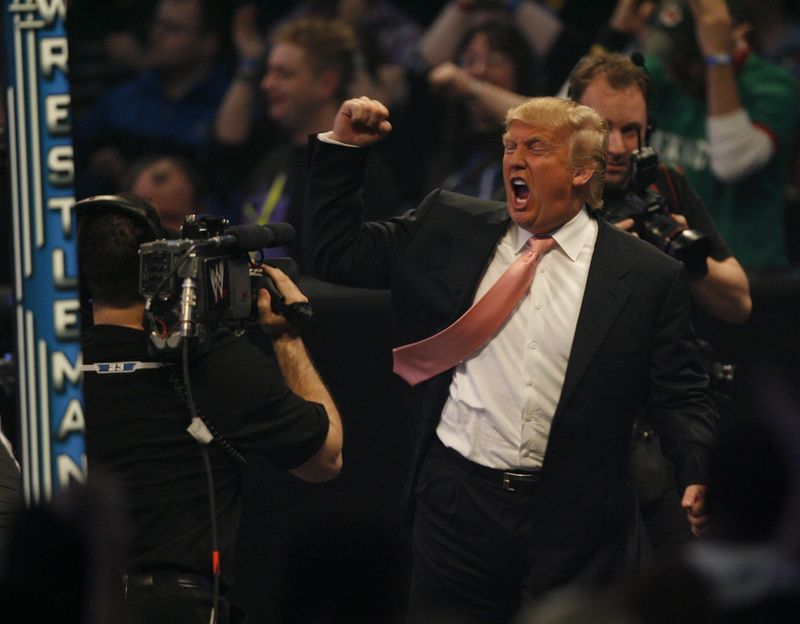 President of the United States, Donald Trump, gives a celebratory fist pump at WWE Wrestlemania
